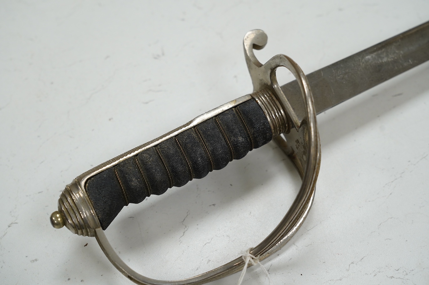 A George VI Royal Artillery officer’s sword, regulation etched blade and plated triple bar guard, blade 85.5cm. Condition - good